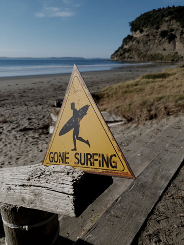 GONE SURFING TIN SIGN